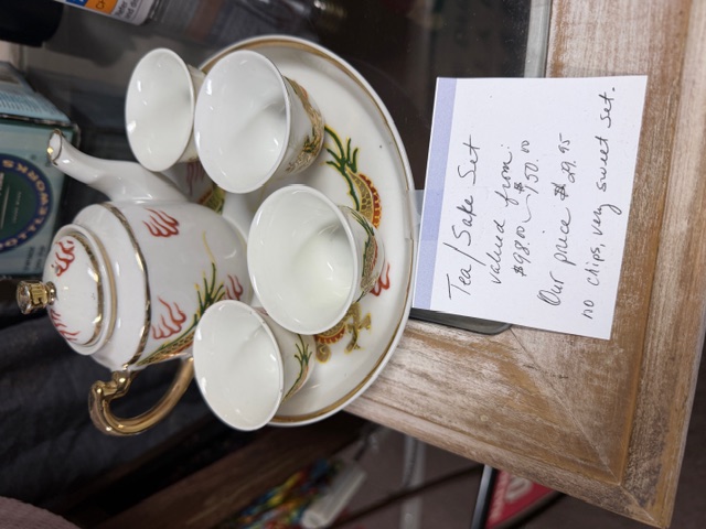 Porcelain tea and sake set with teapot and cups on a matching tray